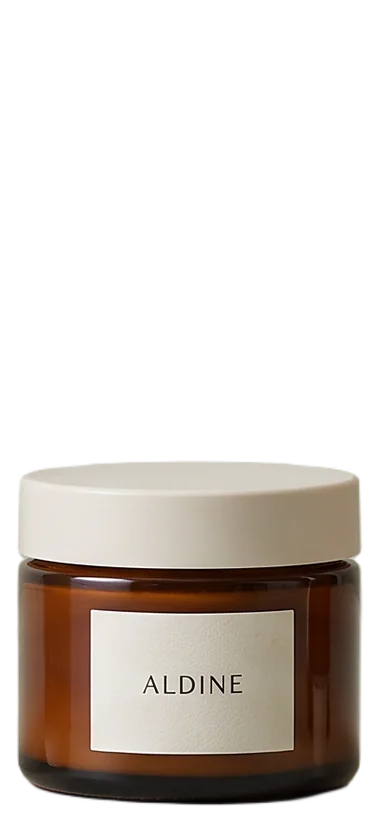 Wide amber glass jar of Day cream with a bone-white lid