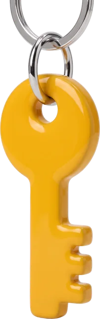 A chunky yellow enamel key charm on a chrome ring