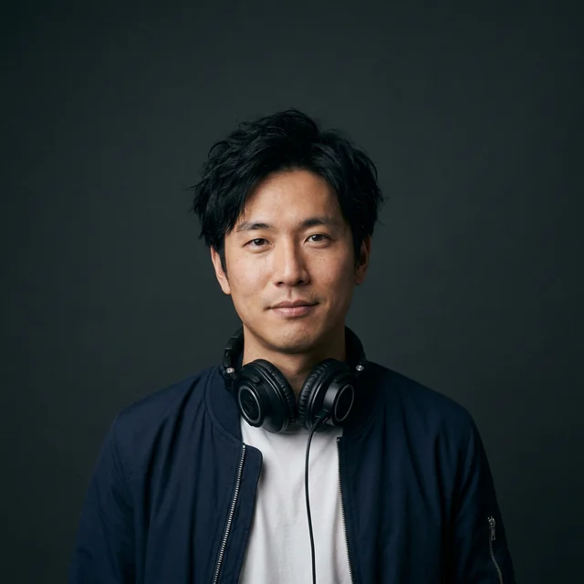 Jun Sato, a fictional podcast host with tousled black hair in a navy bomber jacket, headphones around his neck