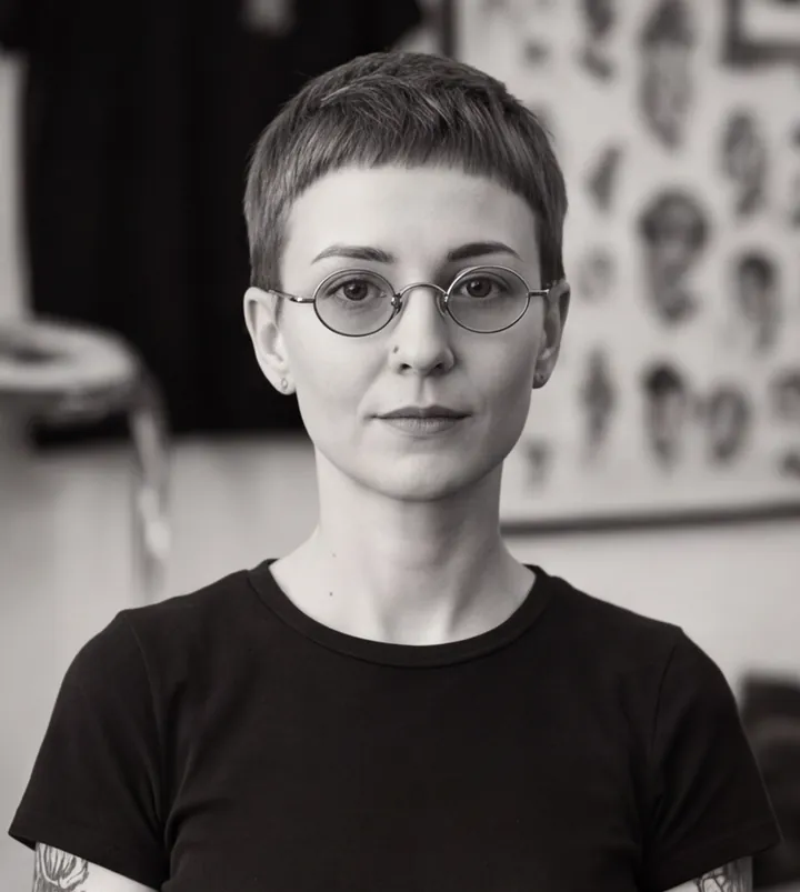 Black and white portrait of Marta Vilhena, a fictional tattoo artist